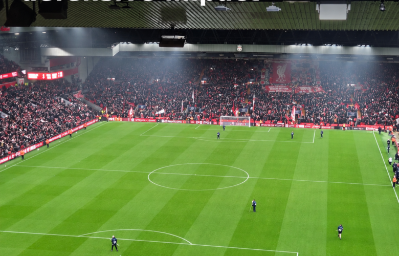 Wide-angle photograph of Anfield showing the pitch and packed stands, with the headline ‘Araújo’s defensive impact’ in white text across the top.
