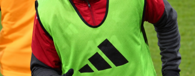 Rio Ngumoha wearing a green training bib during a Liverpool warm-up at Craven Cottage in January 2026.